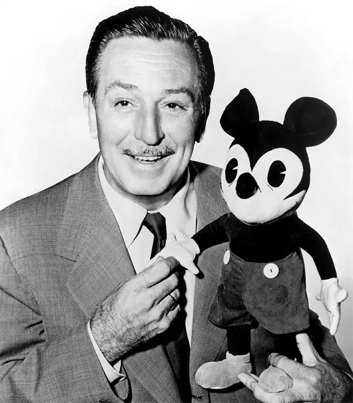 Walt Disney with early plush version of Mickey Mouse