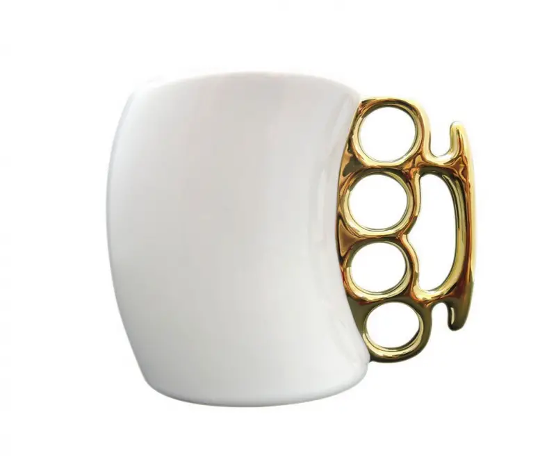 brass knuckles mug gold