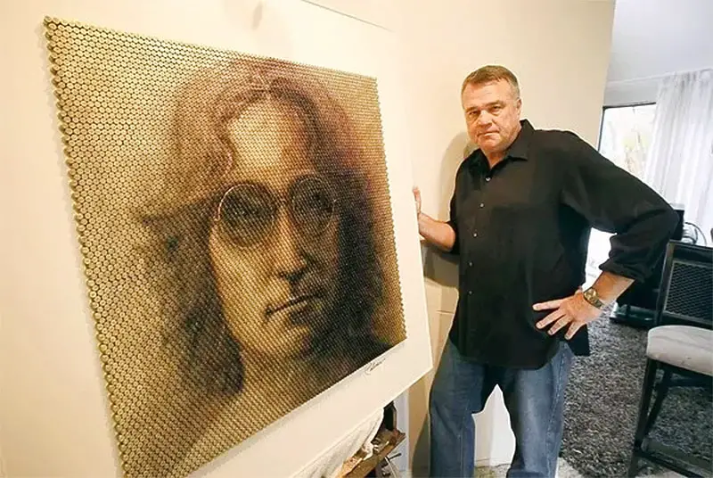 David Palmer with his Lennon portrait made of bullet casings