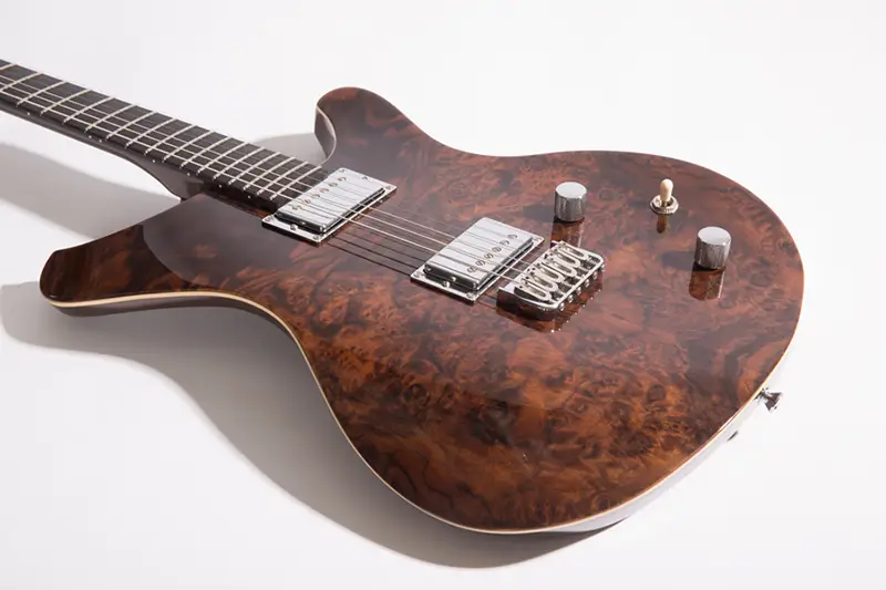 sinuous burled wood guitar