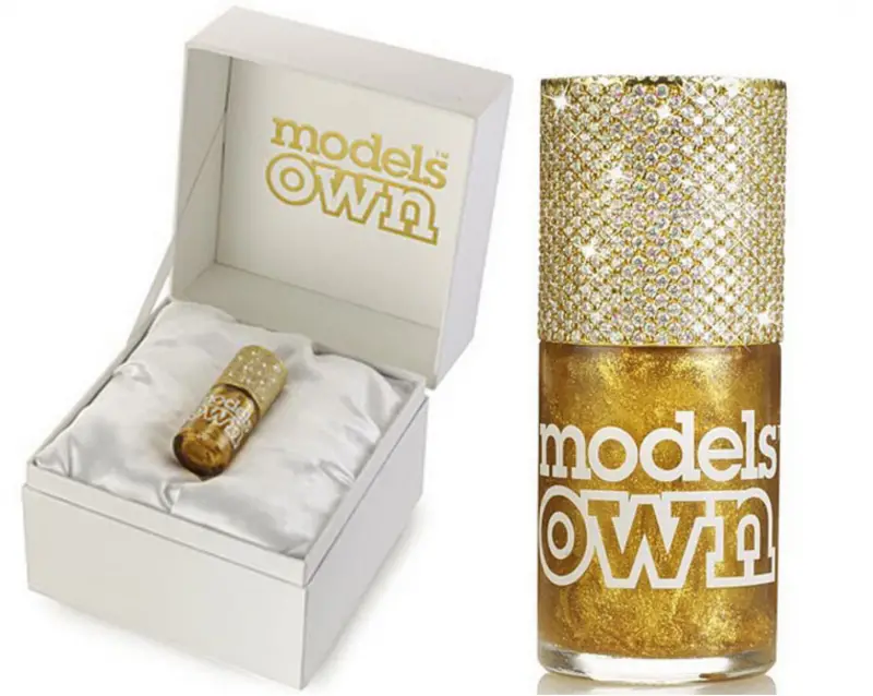 models own Gold Rush Couture polish in a bottle with a real yellow gold cap studded with 1,118 diamonds.