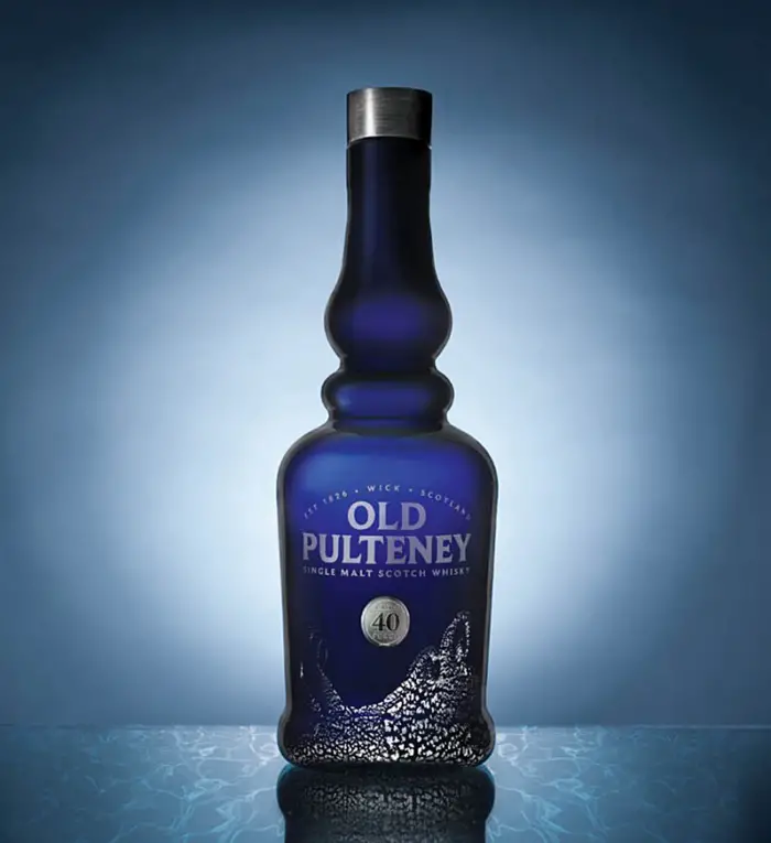 Read more about the article Old Pulteney 40 Year Old Unveiled In Special Hand Blown and Sterling Silver Bottle With Stone Closure and Blue Lacquered Box.