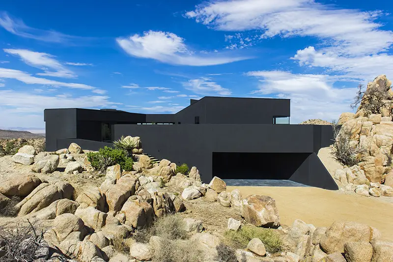 modern black house in the desert