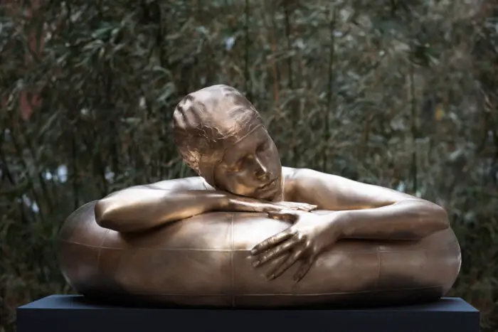 Bronze sculpture of woman in Innertube 