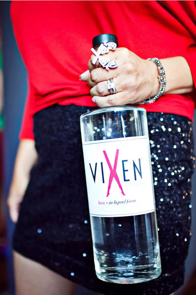 vixen woman holding bottle IIHIH