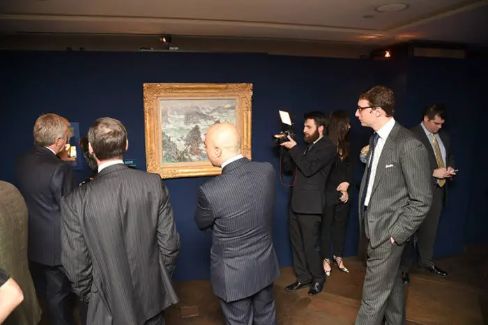 Visitors admire Claude Monet's Storm on the Coast of Belle-Ile at the new Buccellati Flagship Store on Madison Avenue