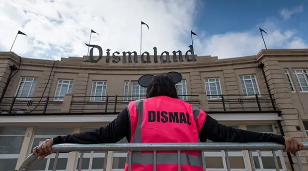 dismaland entrance and staffer