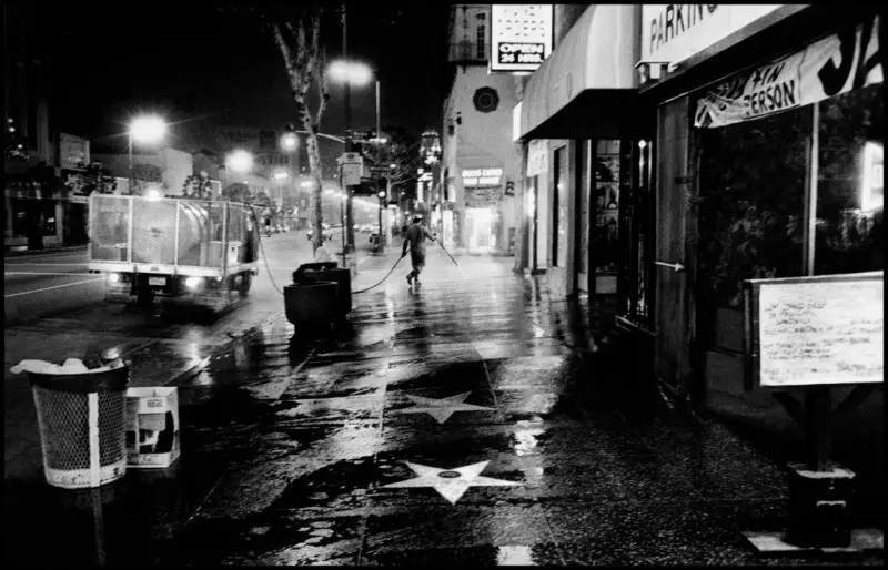 Jim Goldberg, 1988 "Thanksgiving" Washing off Hollywood Boulevard at night.