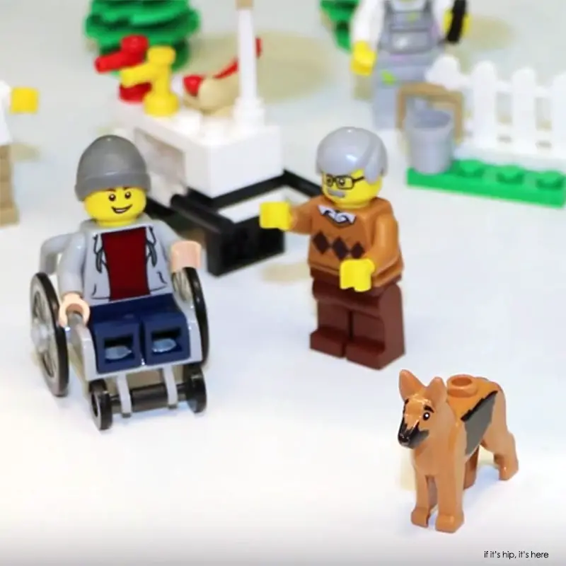 LEGO minifig in wheelchair with assistance dog