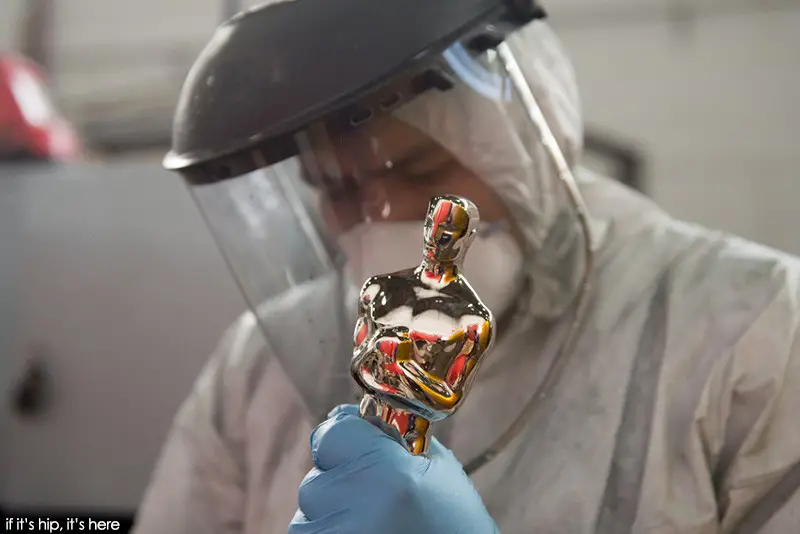 polishing oscar statuette