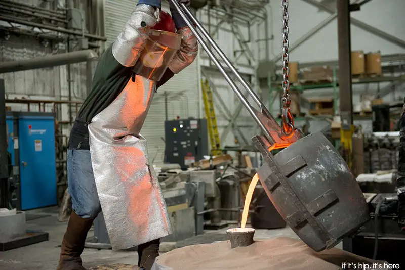 pouring the molten bronze