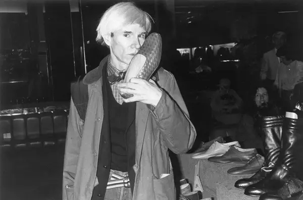 Andy Warhol kissing a shoe