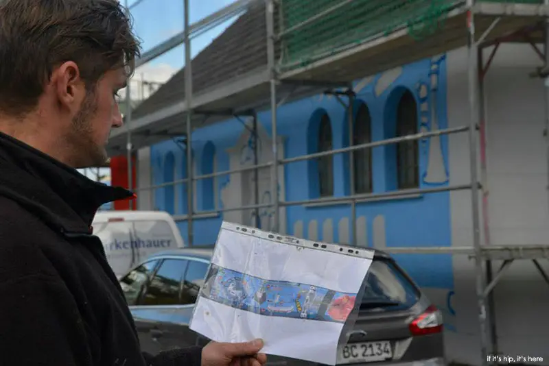 Martin studies the art for the building