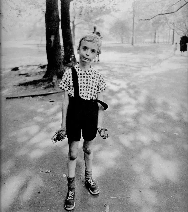 Child with a toy hand grenade in Central Park, N.Y.C., 1962