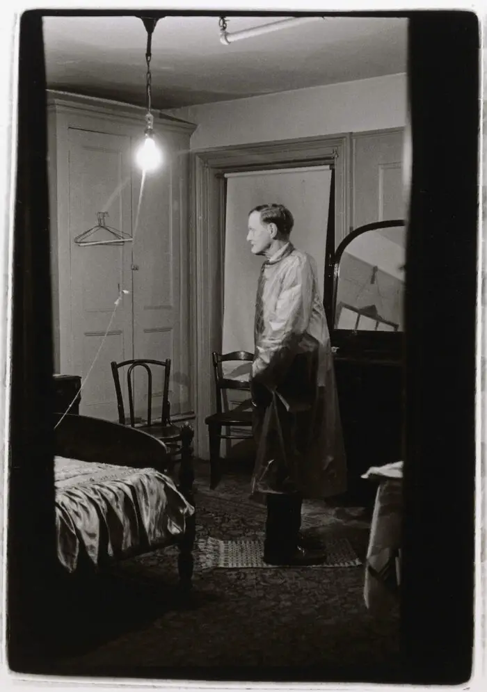 Diane Arbus, The Backwards Man in his hotel room, N.Y.C. 1961