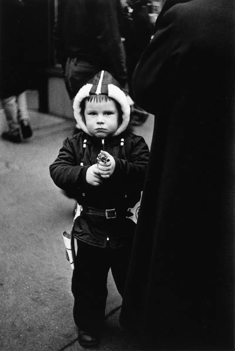 Kid in a hooded jacket aiming a gun, N.Y.C. 1957