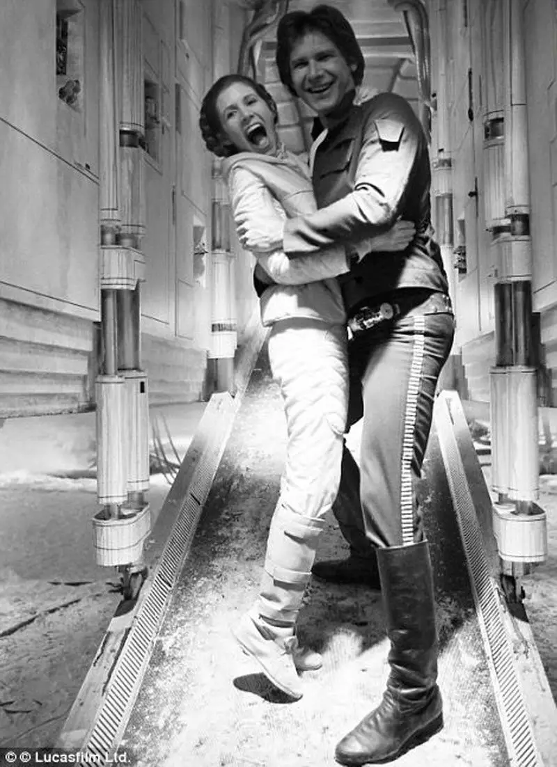 Carrie Fisher and Harrison Ford goofing around on set.