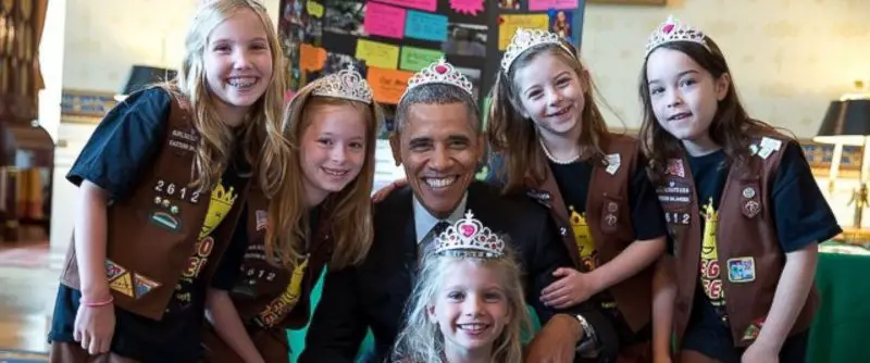 President Obama dons a tiara with a troop of eight year old Brownies
