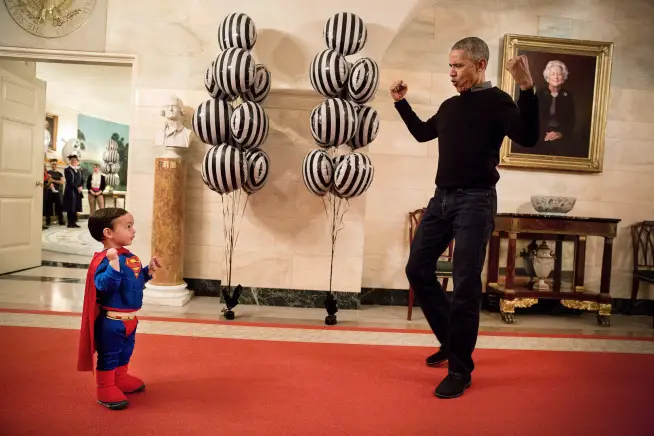 President Obama poses with a tiny little Superman at the White House for Halloween.