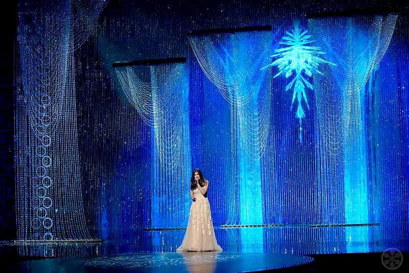 Idina Menzel performs with the Ice Palace Swarovski Crystal backdrop