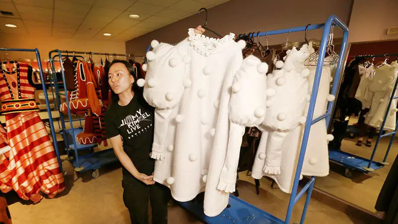 Wardrobe supervisor Tomoko Ueda Dunbar with some of the costumes, photo LA Times