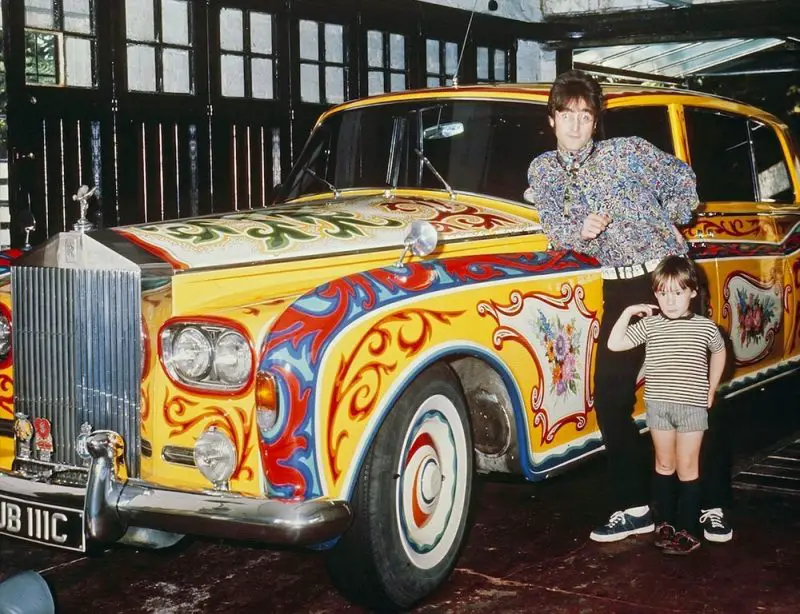 John Lennon and son Julian posing with the customized Phantom