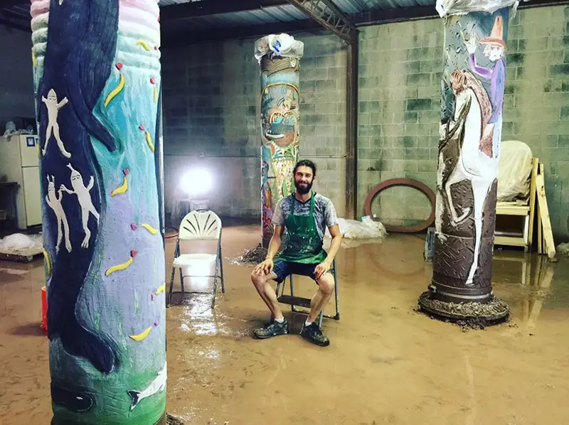 Tom Franco among his decorated sewer pillars