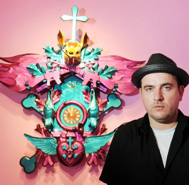 Artist Stefan Strumbel and one of his older Cuckoo Clocks