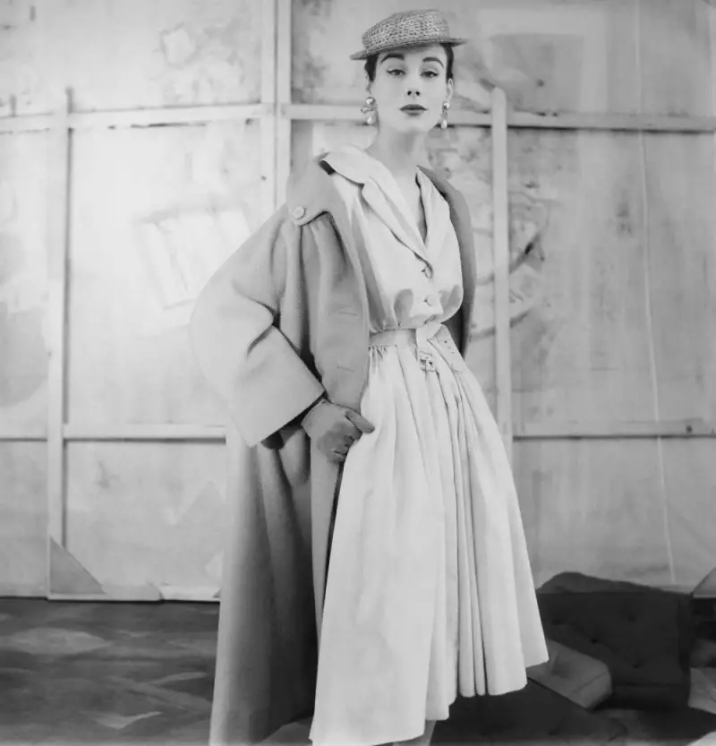 Model wearing shirtdress with tied buckled belt and coat both by Givenchy, Henry Clarke for Getty images