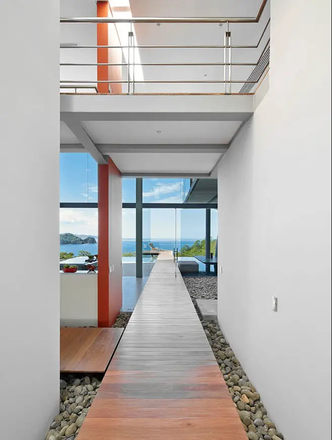 wooden walkway through house to outdoors