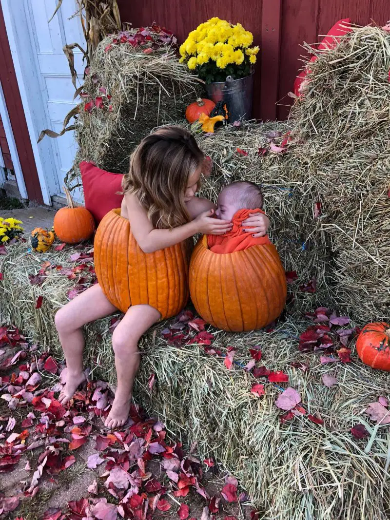 baby in pumpkin