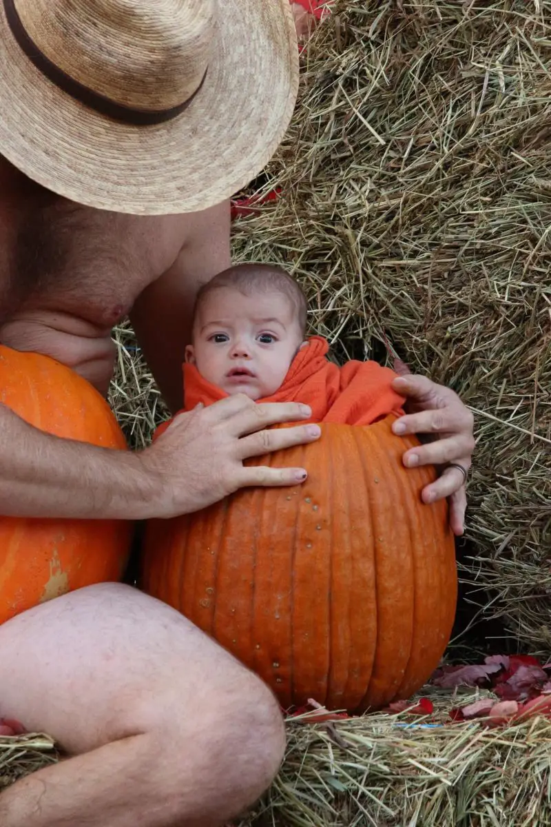 family wearing pumpkins