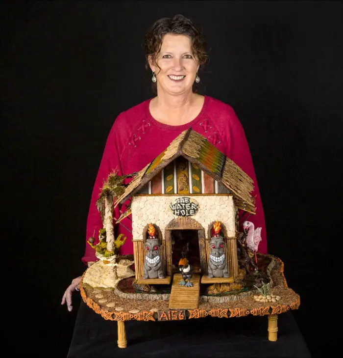 Gail Oliver with her Jungle Tiki-like Gingerbread creation