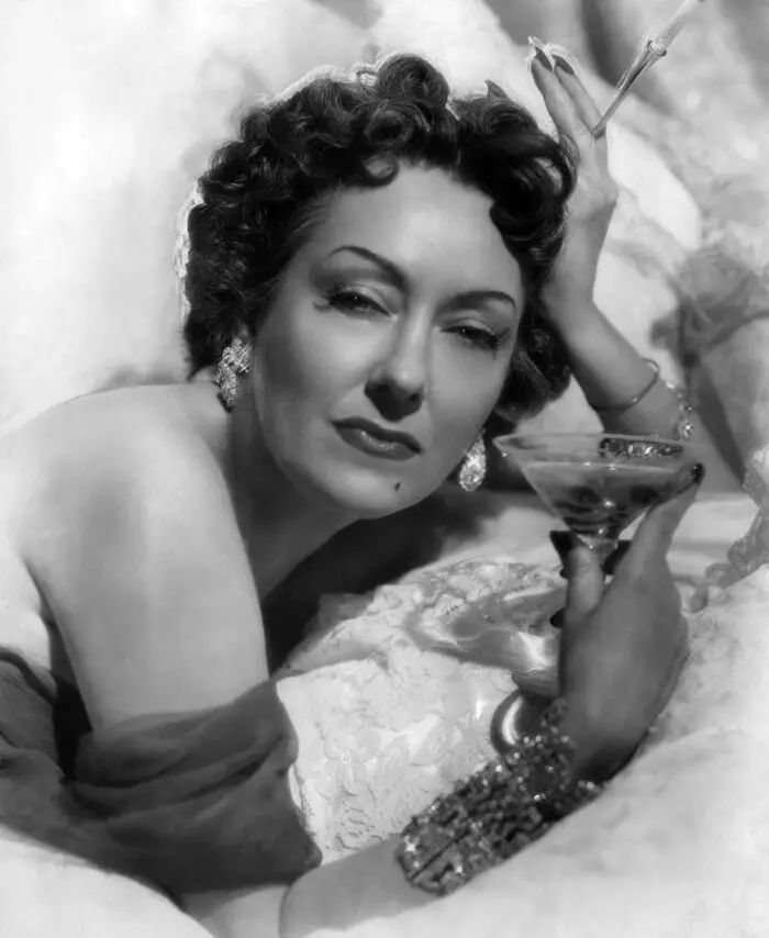 Gloria swanson sipping champagne