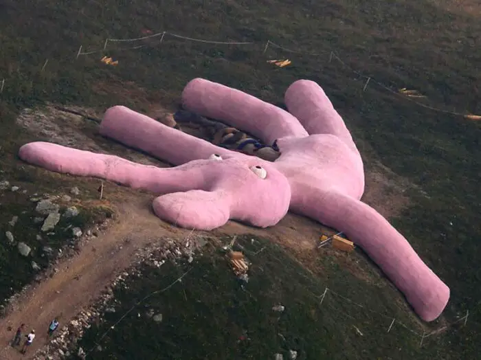Read more about the article Giant Pink Bunny Knit by Grannies Left to Rot On Italian Hillside