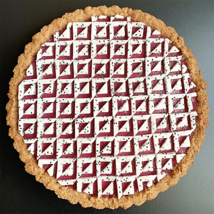Blackberry curd tart with a pecan crust and dragon fruit tiles.