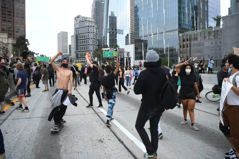 Protestors block the 110 Freeway in downtown Los Angeles