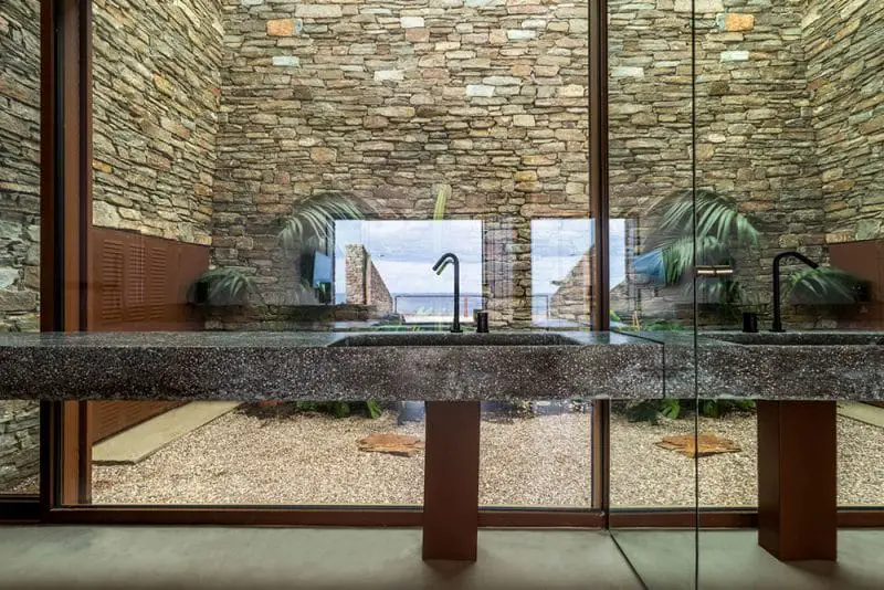stone glass and concrete bathroom
