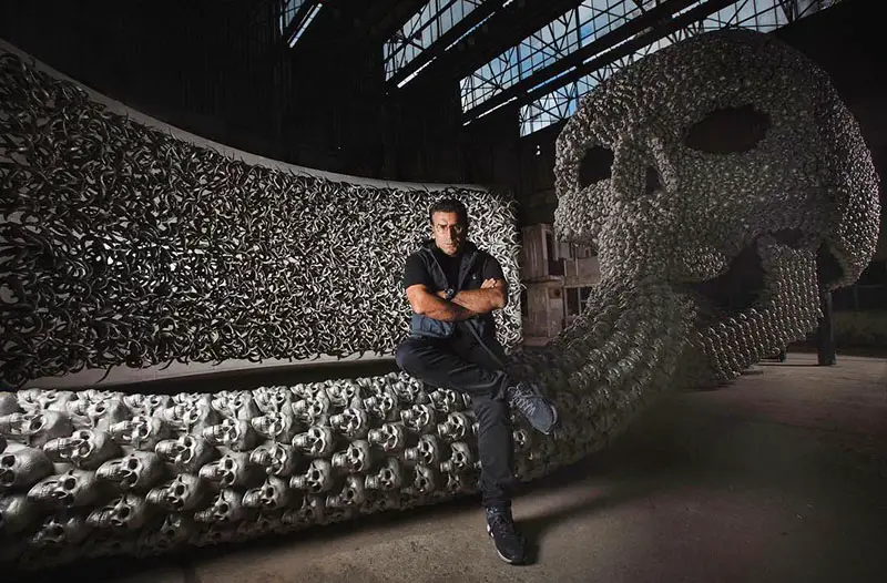 Turkish artist Ahmet Gunestekin sits on his "Chamber of Immortality