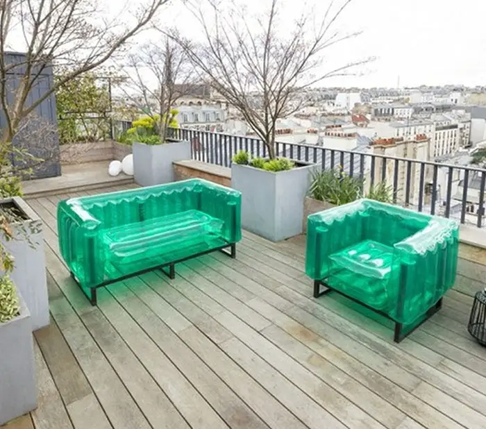 Green blow-up sofa and armchair with metal frames