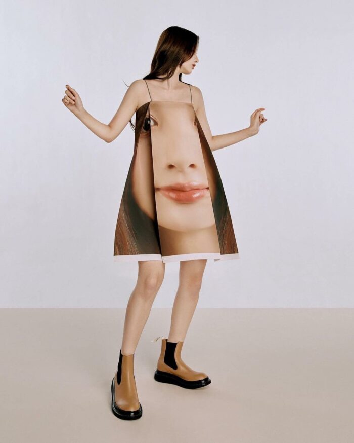 girl in dress with photo of face on it