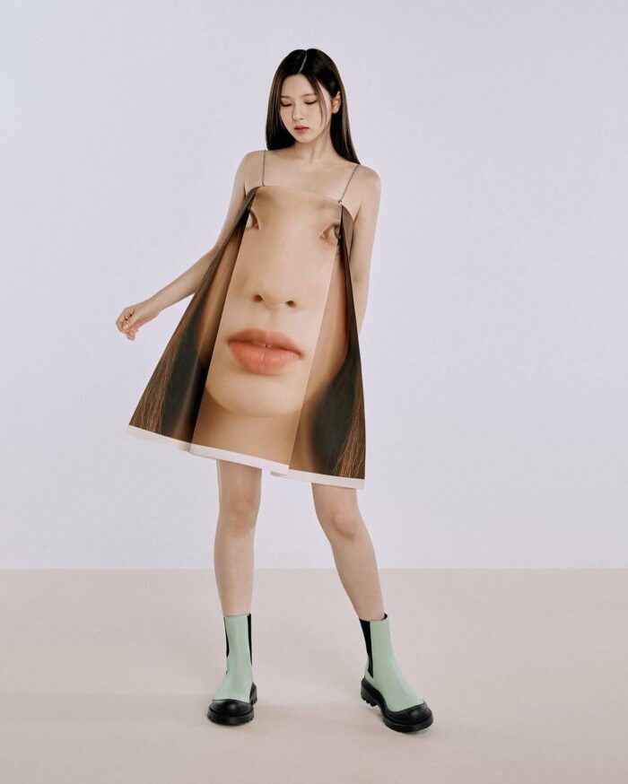 girl in dress with photo of face on it