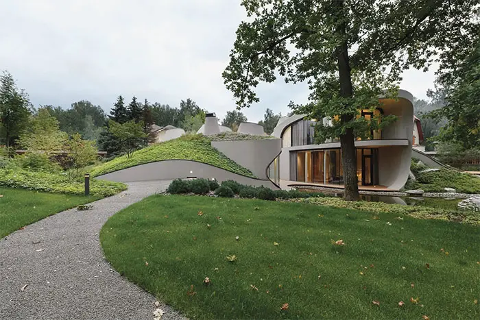 niko arch house in landscape