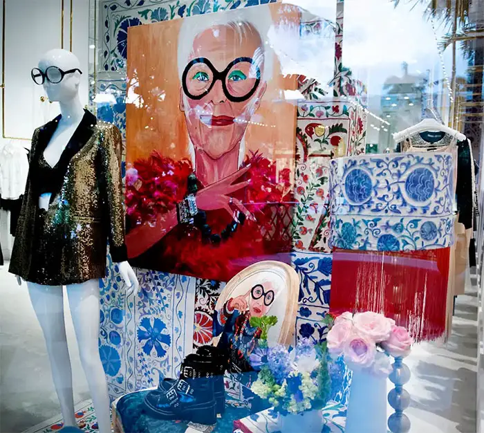 The window alice + olivia by Stacey Bendet pays tribute to fashion icon Iris Apfel during the annual Holiday Tree Reveal and Celebration at the Royal Poinciana Plaza