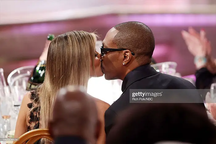 Eddie Murphy and Paige Butcher steal a kiss