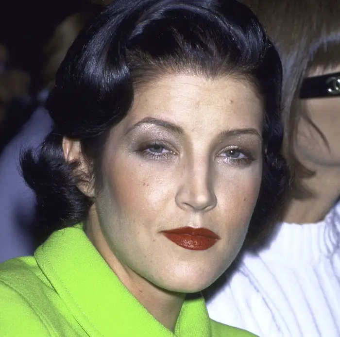 Lisa Marie Presley's Changing Looks the front row at a fashion show in 1996