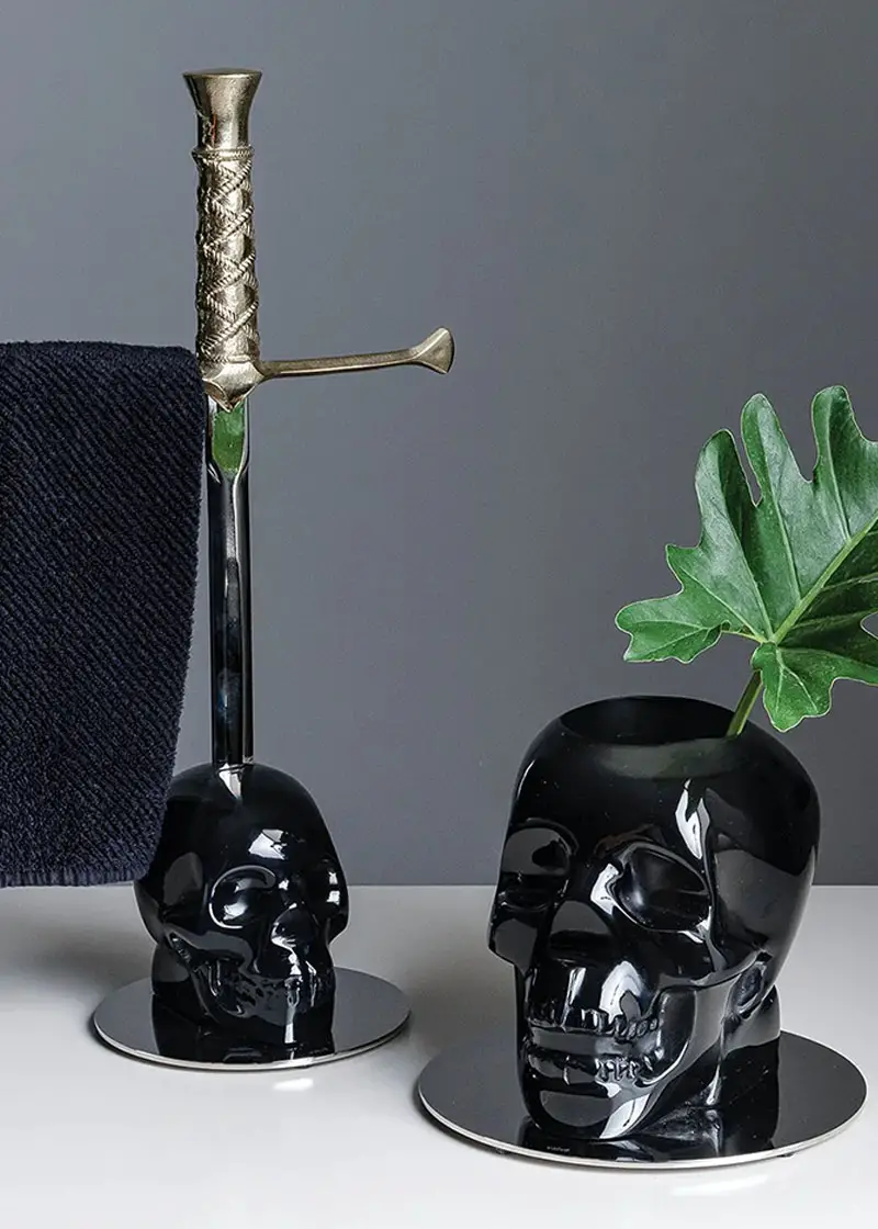 black skull vase and towel rack