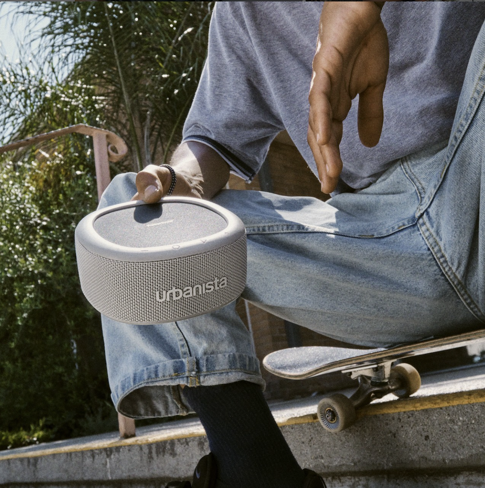 man holding wireless speaker