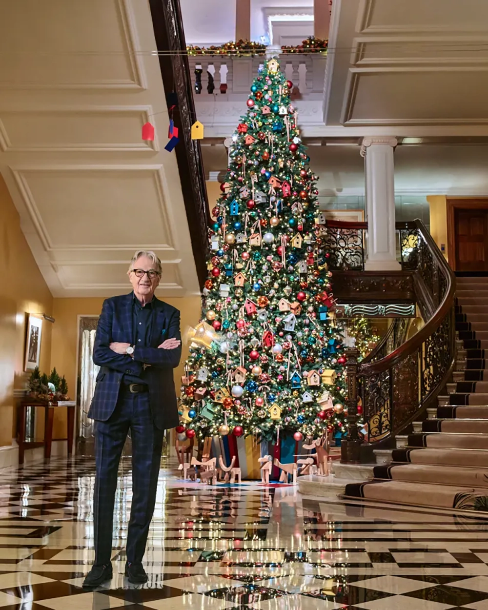 Designer Sir Paul Smith with his tree for Claridge's